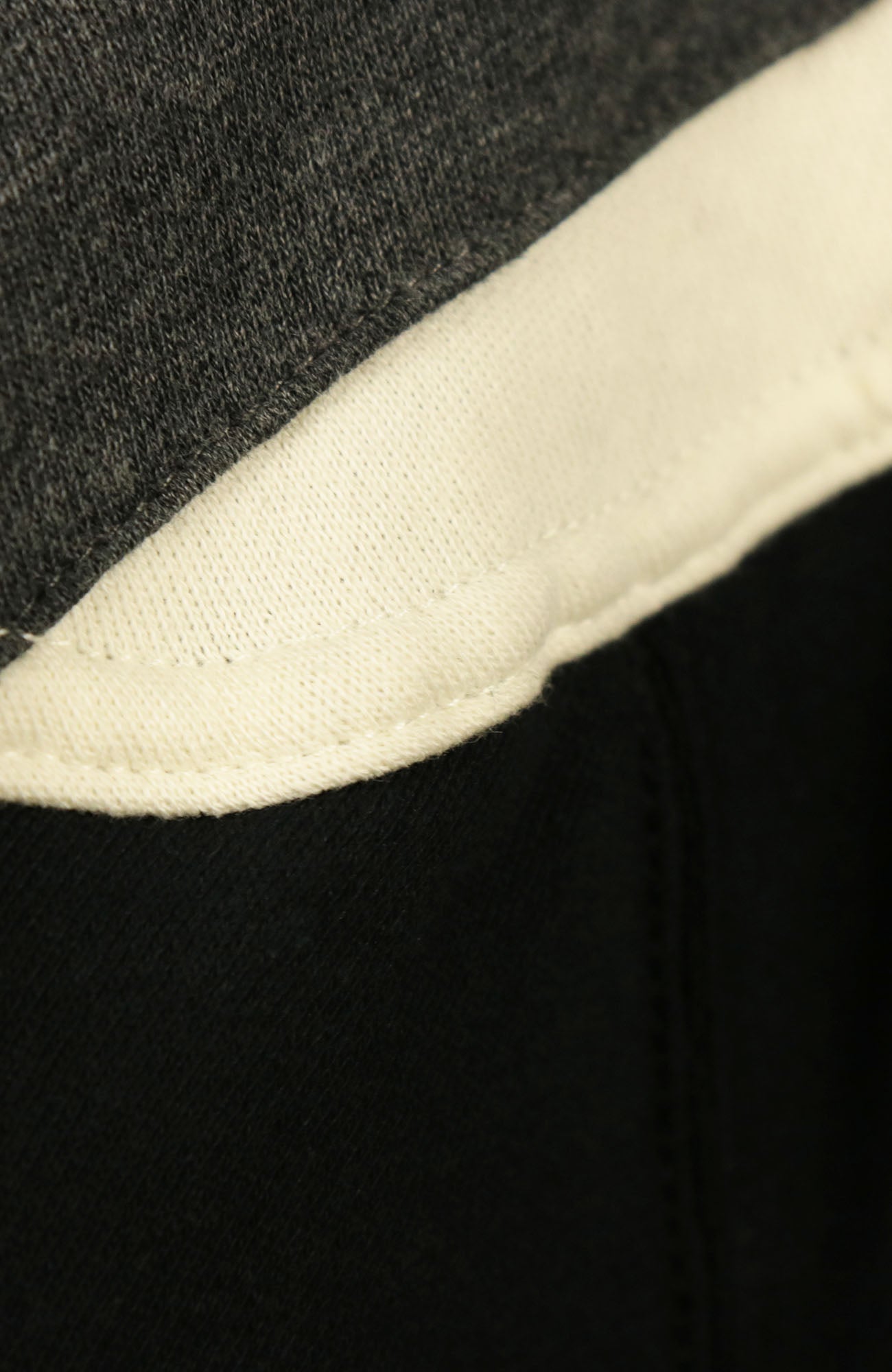 Close up on stitching on the Philadelphia Phillies Vintage Hockey 47 Lacer Hoodie |  Black, Gray, White