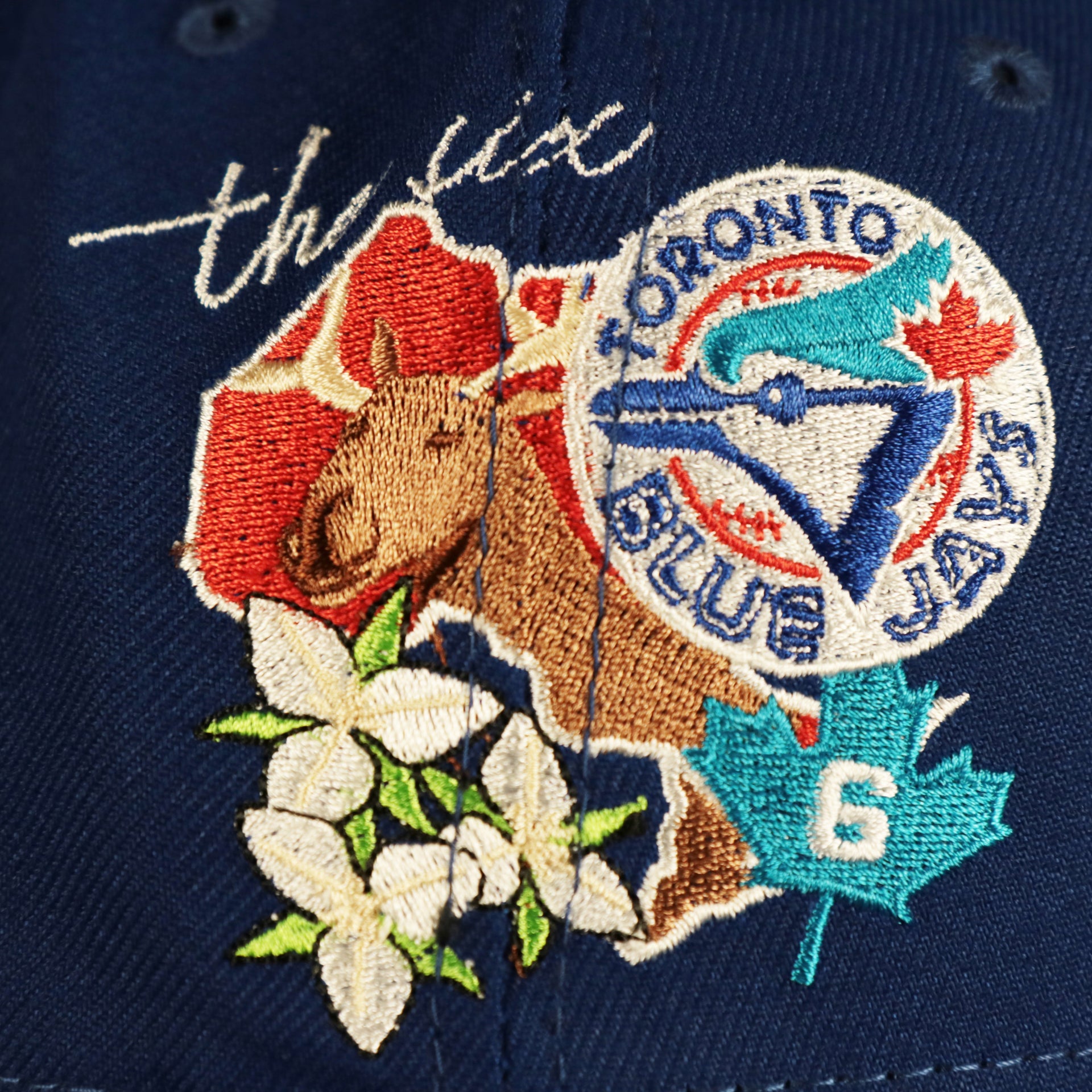 Close up of the side patch on the Toronto Blue Jays "City Cluster" Side Patch Gray Bottom Royal 59Fifty Fitted Cap
