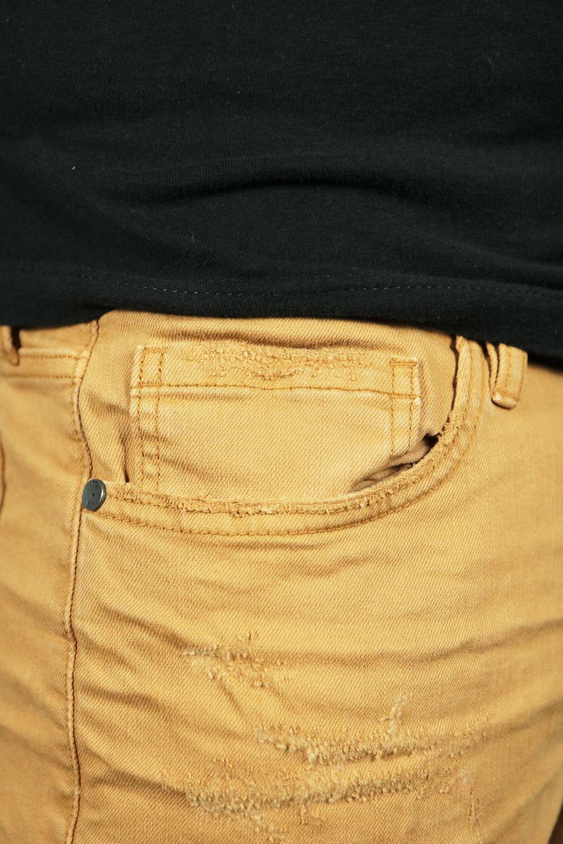 The pocket of the khaki grunge shorts by Jordan Craig.