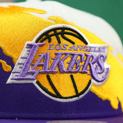 lakers logo on the Los Angeles Lakers Vintage Retro NBA Paintbrush Mitchell and Ness Snapback Hat | Purple/White/Yellow