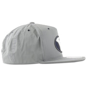 The BYU Reflective Gray Adjustable Snapback Hat has a high structured crown and a flat brim