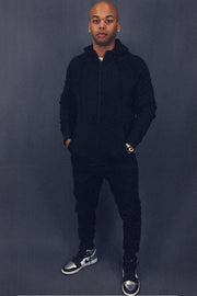 front of the matching set of the Men's Black Fleece Sweatpants Jogger Pants Bottom To Match Sneakers