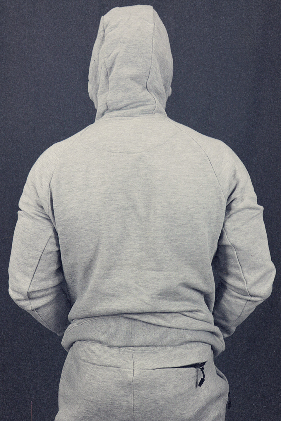 back view of hood on the Men's Heather Grey Fleece Zip Up Hoodie Sweatshirt Jogger Top To Match Sneakers