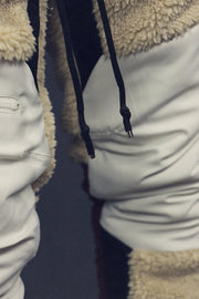 strings on the front of the Foliage Sherpa Tech Pants With Zipper Pockets For Sherpa Two Piece Set To Match Sneakers