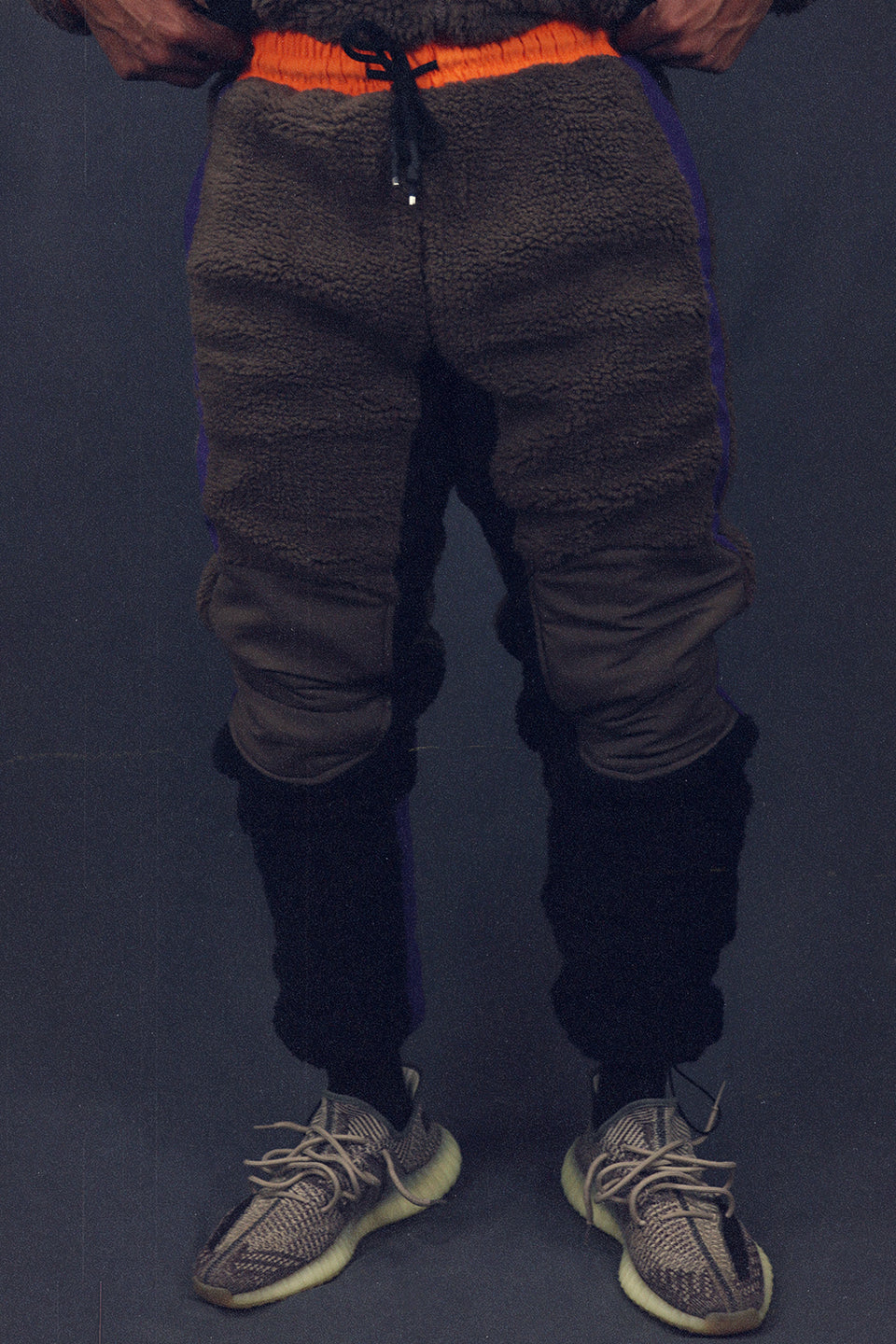 front of the Mocha Sherpa Tech Pants With Zipper Pockets For Sherpa Two Piece Set To Match Sneakers
