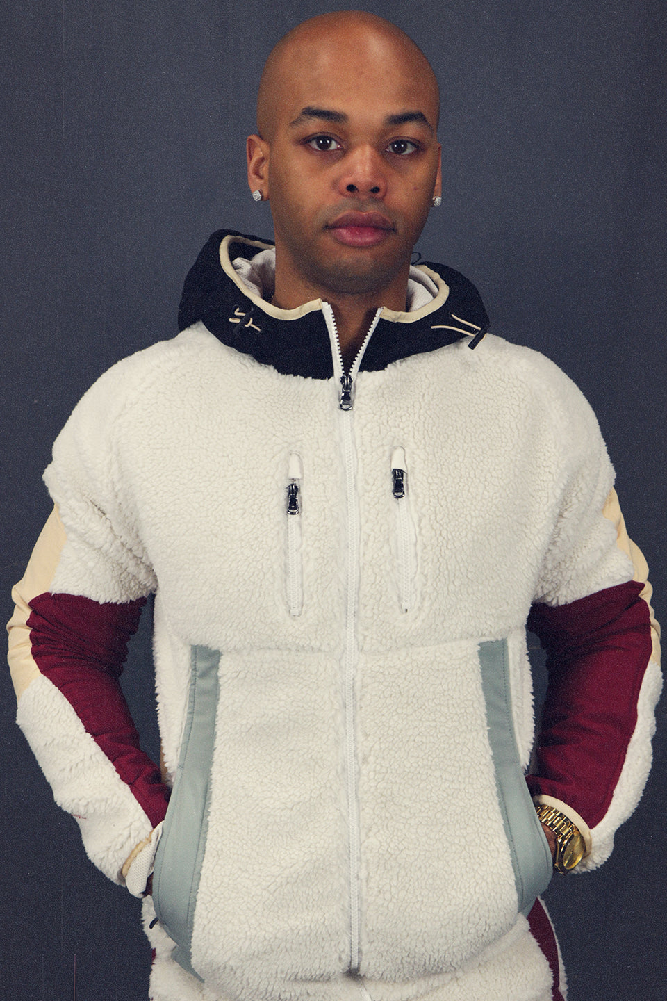 front of the Sedimentary Sherpa Tech Jacket With Zipper Pockets For Sherpa Two Piece Set To Match Sneakers