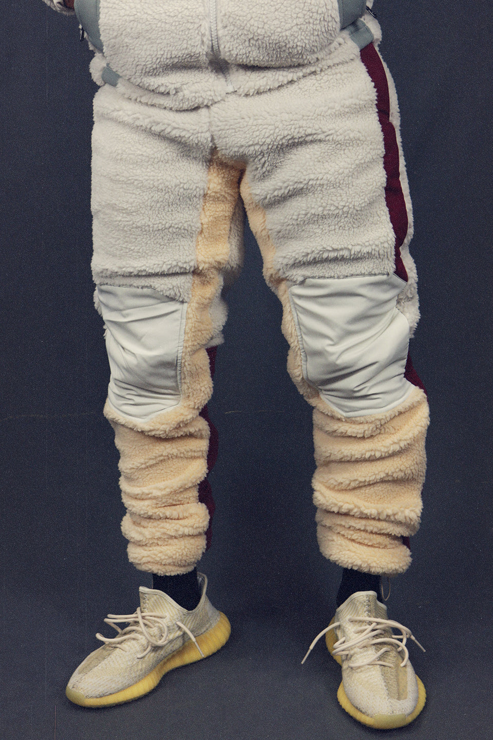 front of the Sedimentary Sherpa Tech Pants With Zipper Pockets For Sherpa Two Piece Set To Match Sneakers