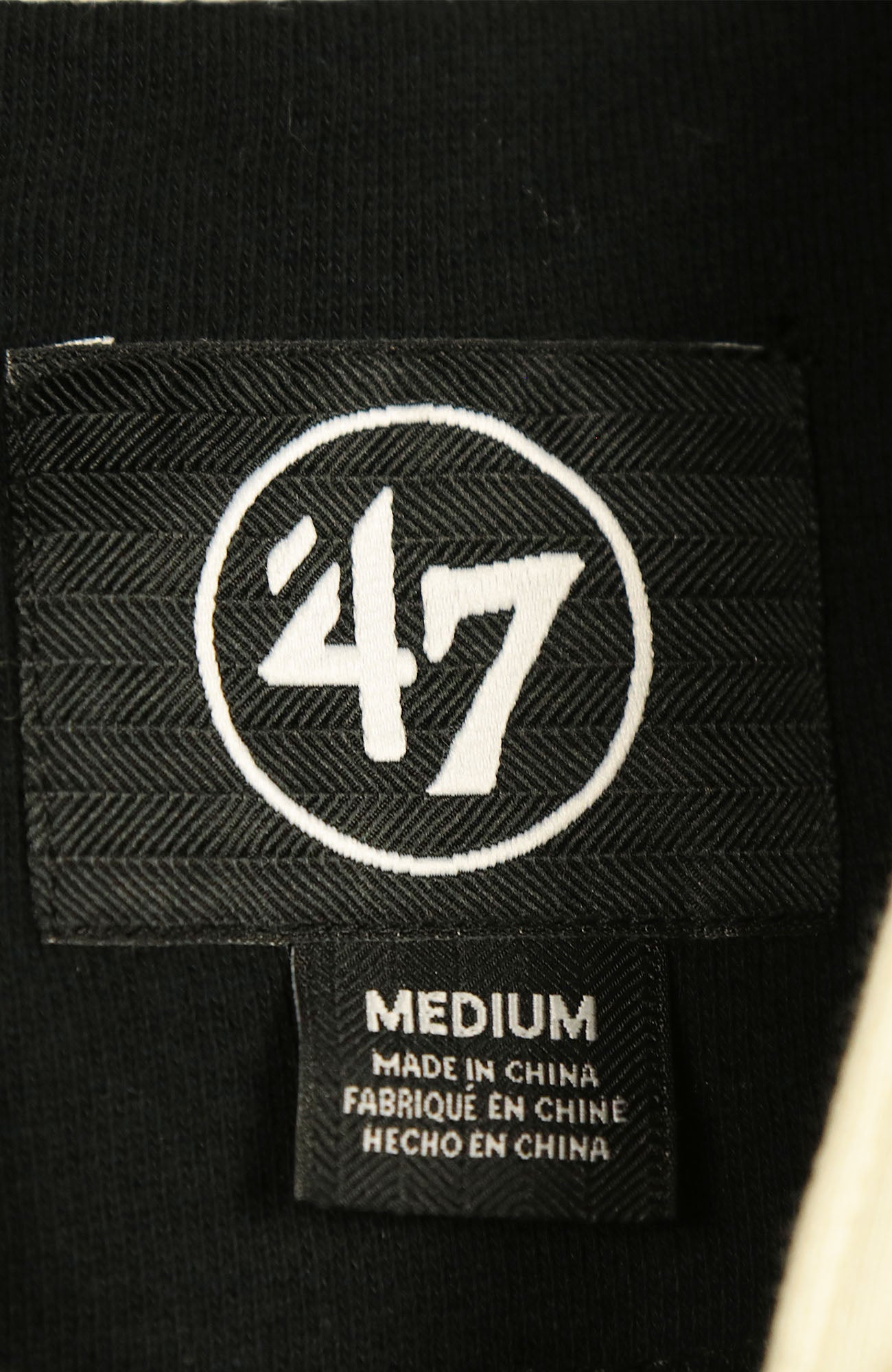 47 brand size tag on the Philadelphia Phillies Vintage Hockey 47 Lacer Hoodie |  Black, Gray, White