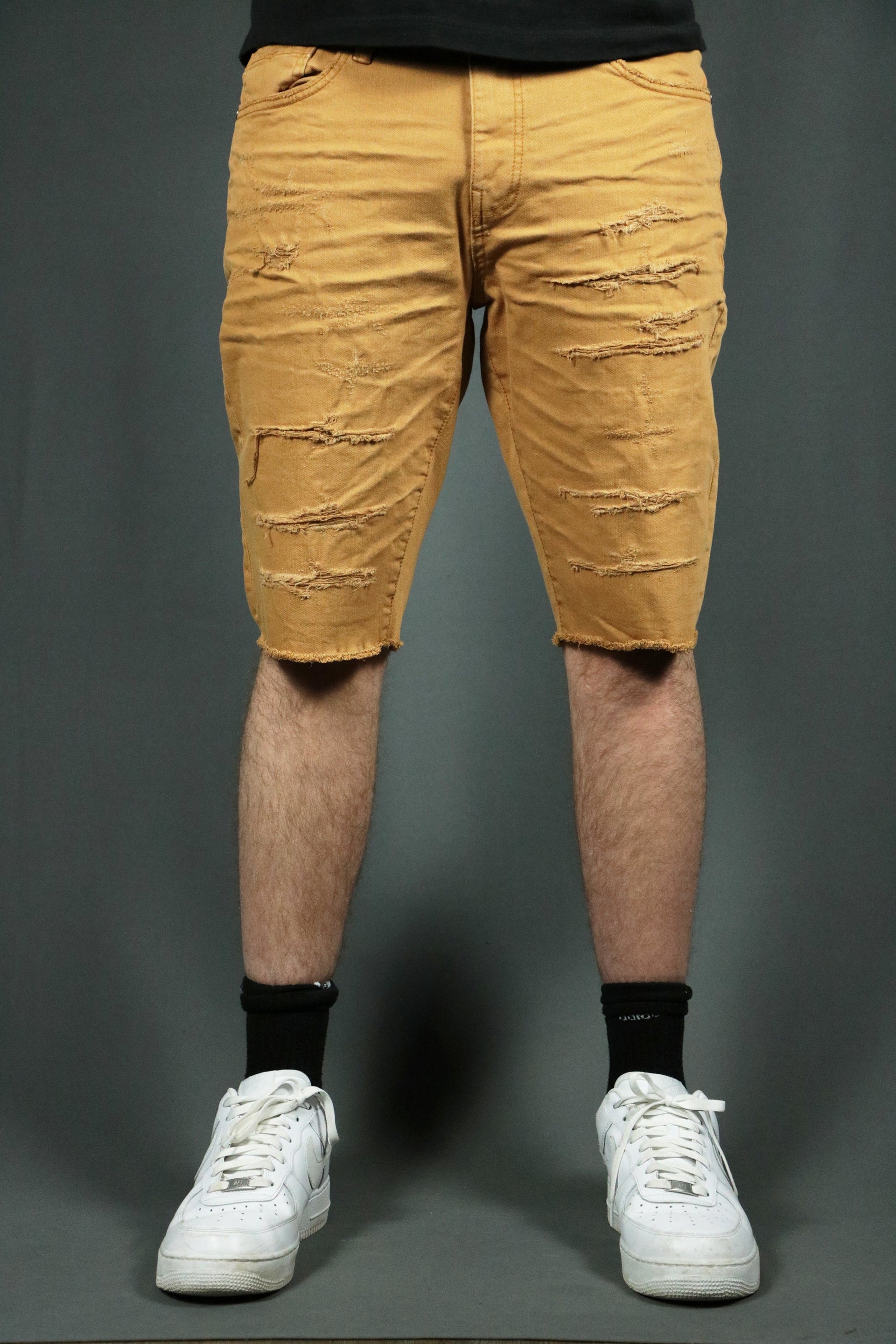Model wearing the khaki ripped men shorts.