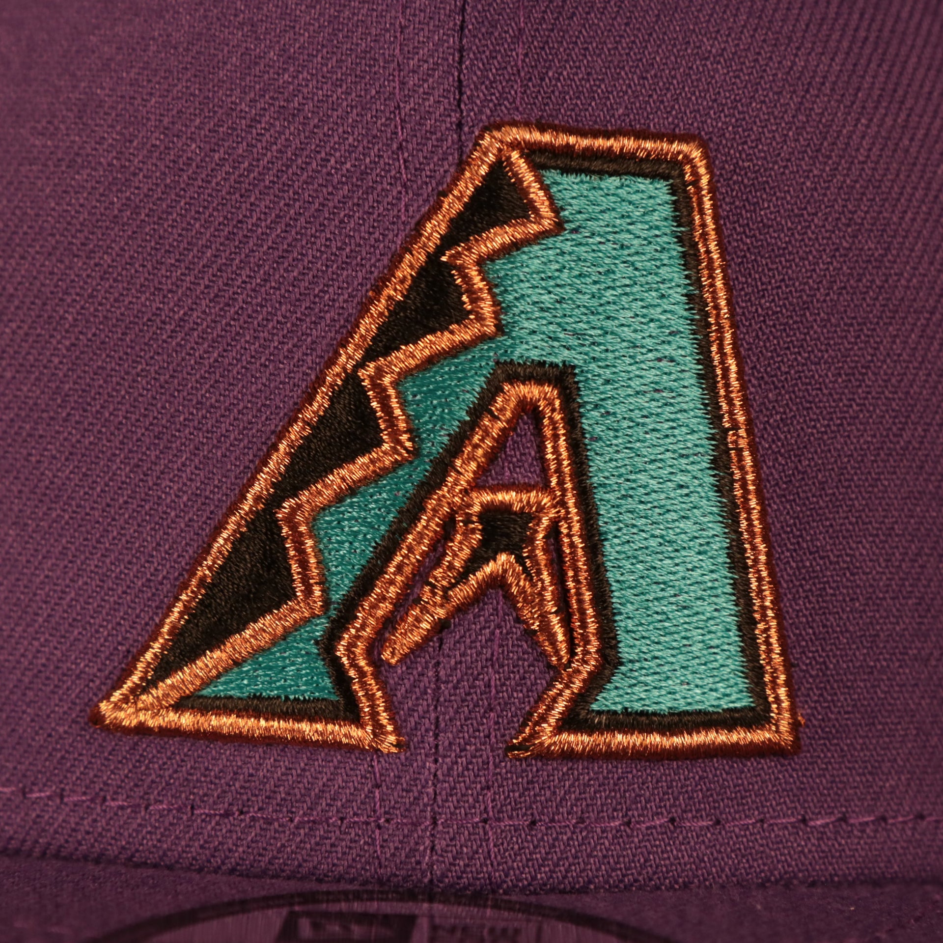 Close up of the Arizona Diamondbacks logo on the Arizona Diamondbacks 2001 World Series Side Patch Gray Bottom 9Fifty Snapback Hat