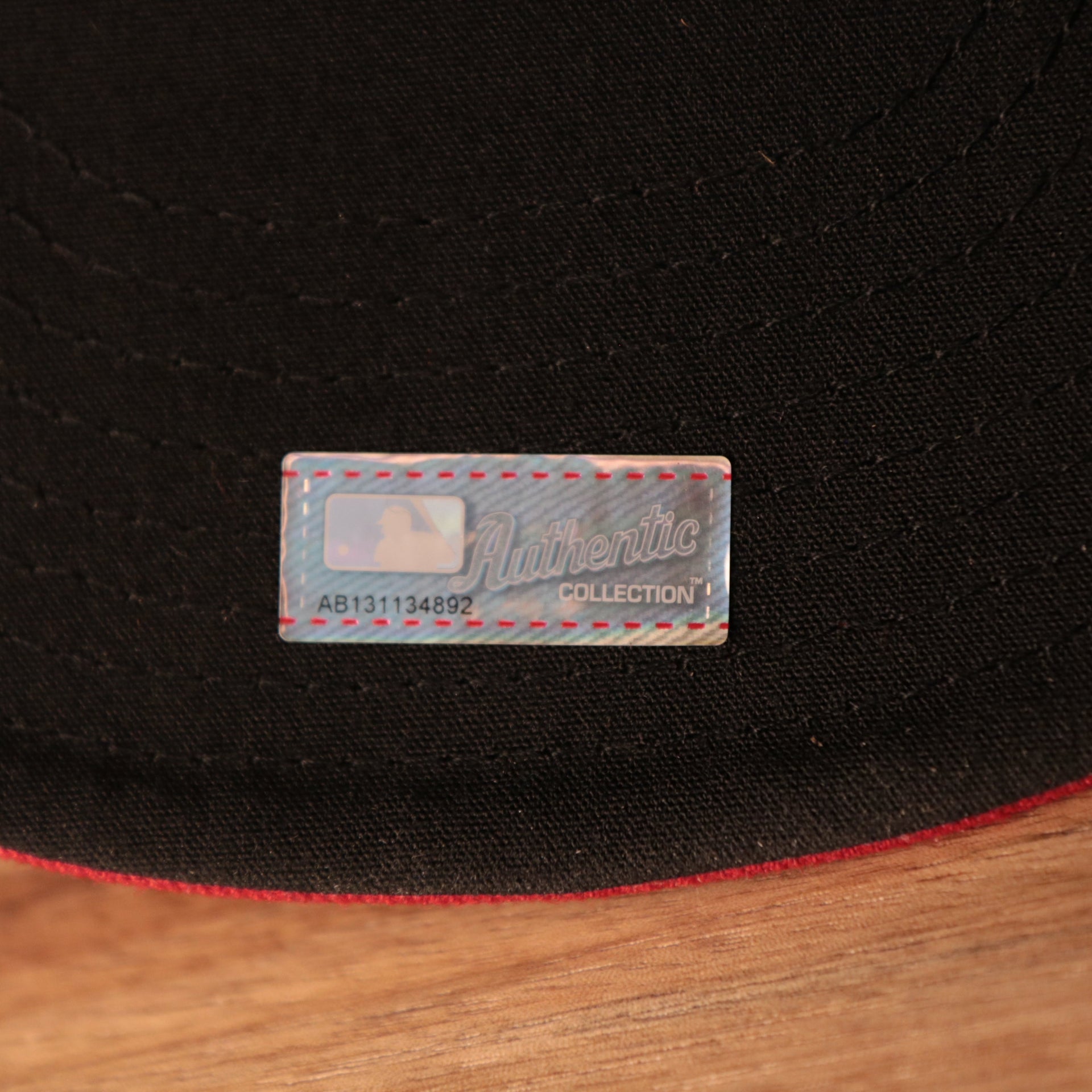 The Authentic MLB Sticker on the Philadelphia Phillies Blue on Red Game Authentic 59Fifty Fitted Cap