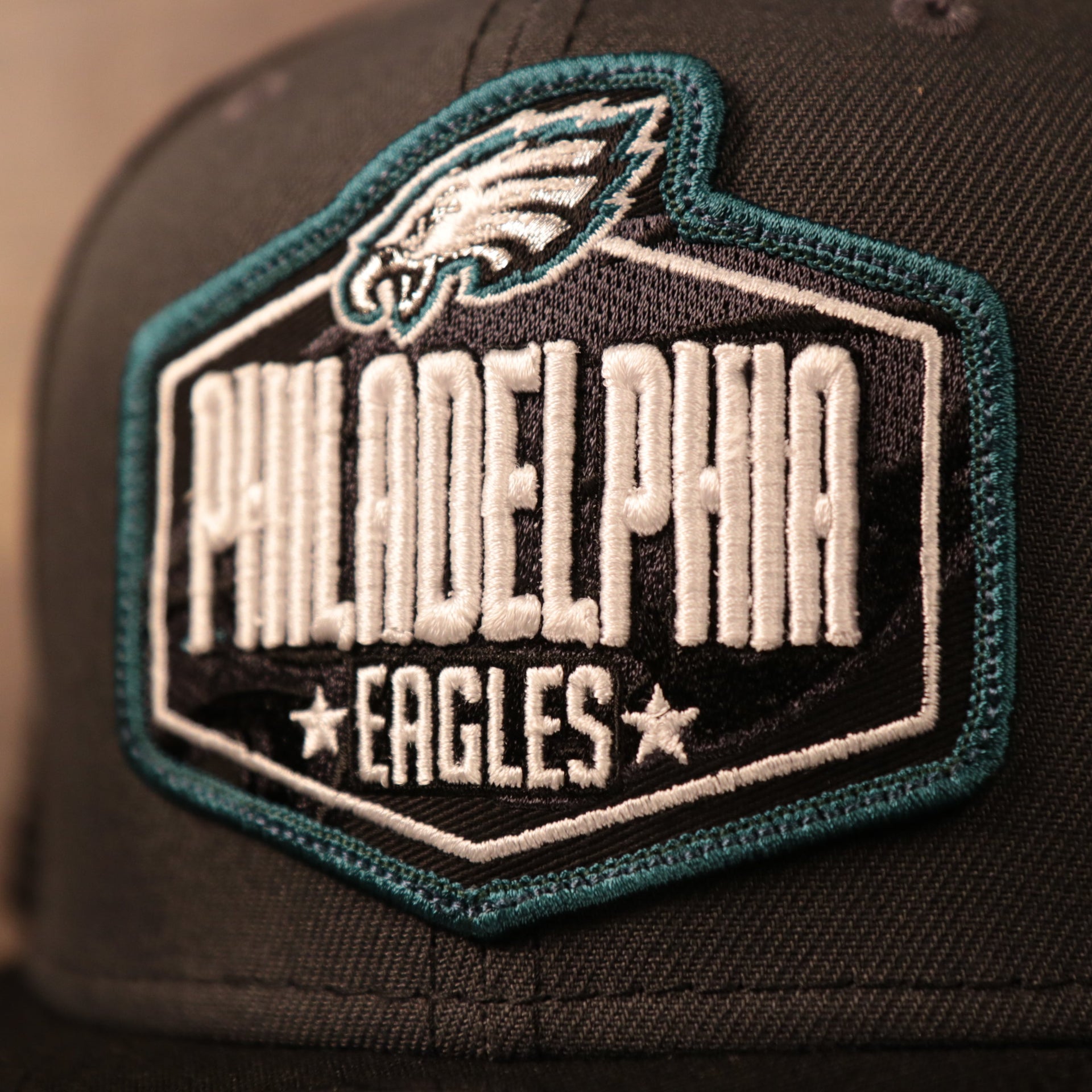 The Philadelphia Eagles logo on the front of the 2021 NFL draft cap.