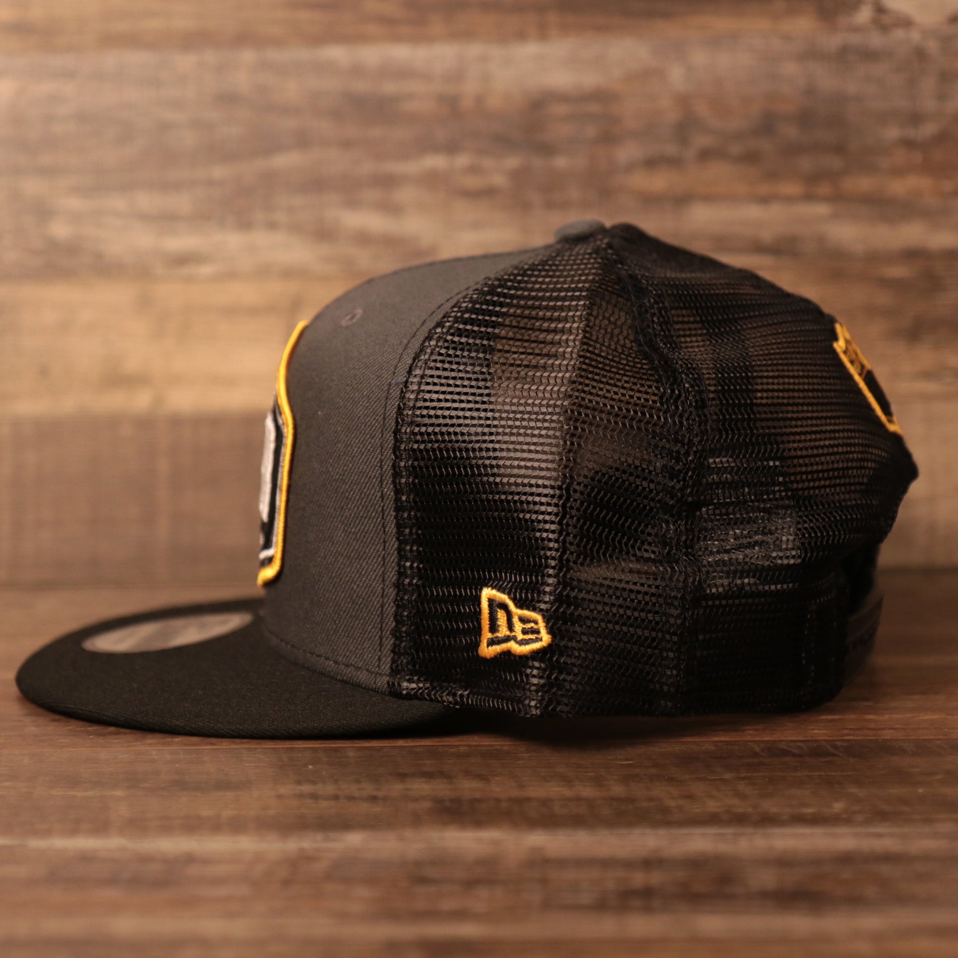 The meshback adjustable trucker hat for the Steel City 2021 NFL Draft from the wearer's left side.