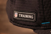 The nfl training logo is on the wearers right side Panthers 2020 Training Camp Snapback Hat | Carolina Panthers 2020 On-Field Black Training Camp Snap Cap