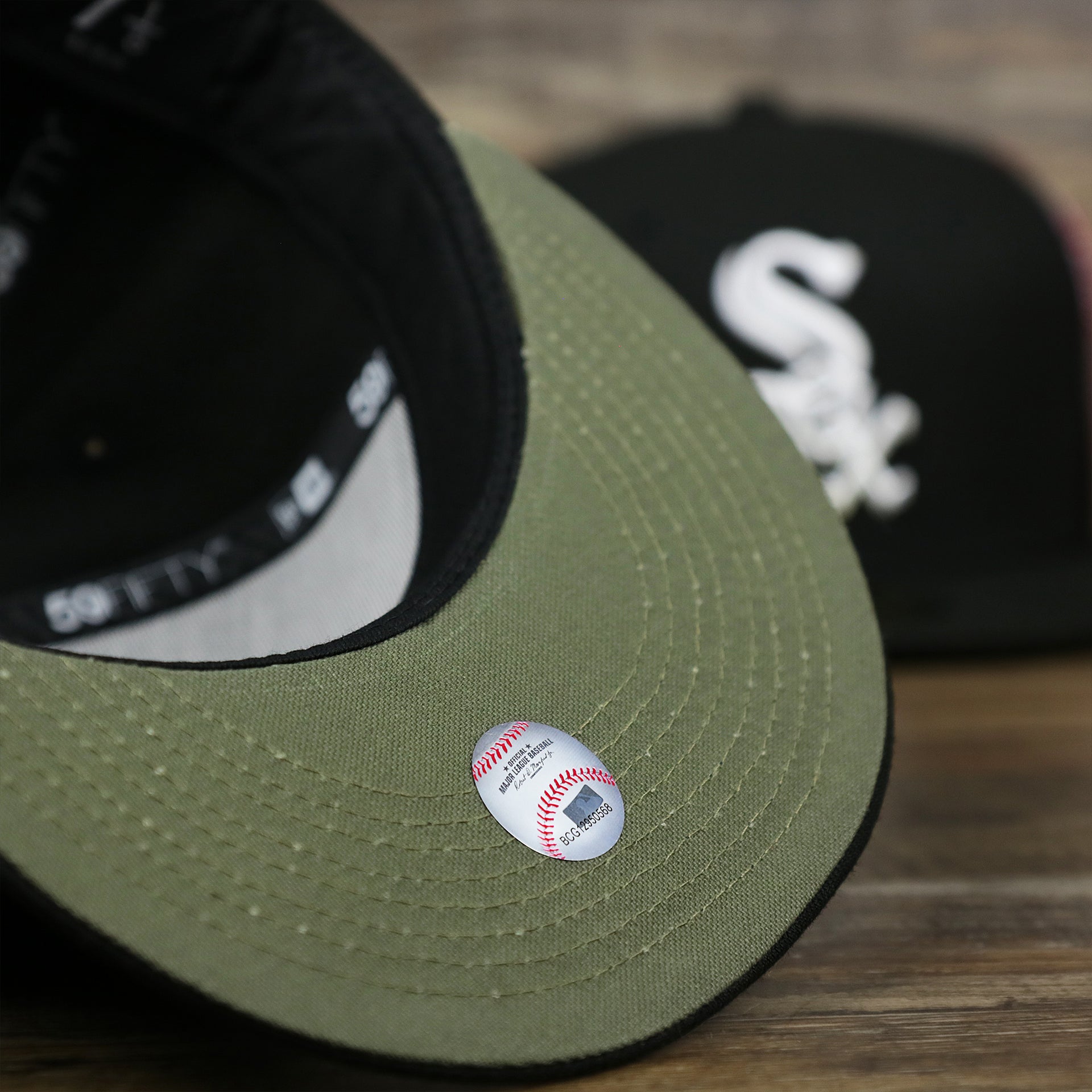 The undervisor on the Chicago White Sox Alpha Industries Side Patch Army Green Undervisor 59FIfty Fitted Cap With Hangtag | Black 59FIfty Cap
