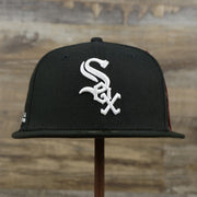 The front of the Chicago White Sox Alpha Industries Side Patch Army Green Undervisor 59FIfty Fitted Cap With Hangtag | Black 59FIfty Cap