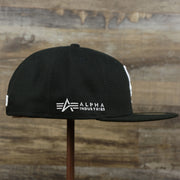 The wearer's right on the Chicago White Sox Alpha Industries Side Patch Army Green Undervisor 59FIfty Fitted Cap With Hangtag | Black 59FIfty Cap