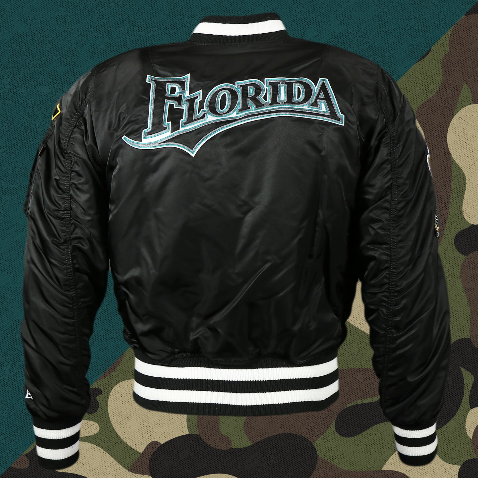 back of the one side of the Florida Marlins MLB Patch Alpha Industries Reversible Bomber Jacket With Camo Liner | Black Bomber Jacket