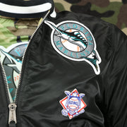 throwback marlins logo and national league patch on the Florida Marlins MLB Patch Alpha Industries Reversible Bomber Jacket With Camo Liner | Black Bomber Jacket