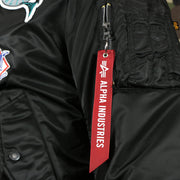 alpha industries tag on the zipper of the Florida Marlins MLB Patch Alpha Industries Reversible Bomber Jacket With Camo Liner | Black Bomber Jacket