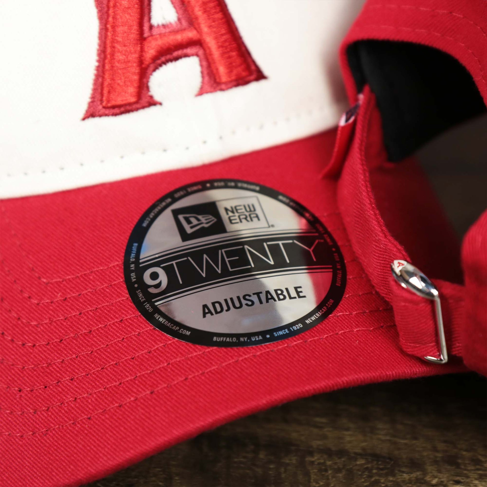 The 9Twenty Sticker on the Anaheim Angles 2021 City Connect 9Twenty Dad Hat | New Era White and Red