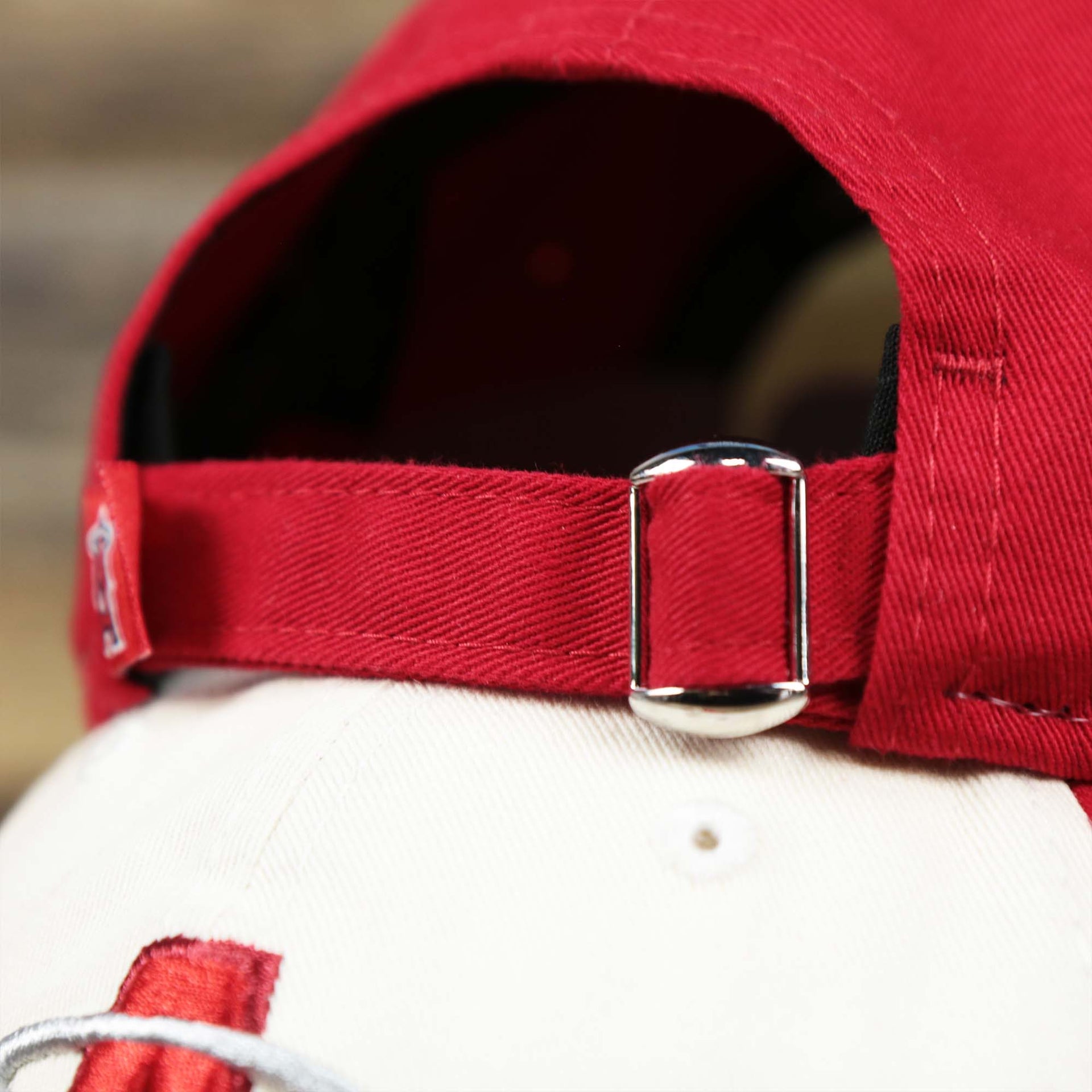 The Metallic Buckle on the Anaheim Angles 2021 City Connect 9Twenty Dad Hat | New Era White and Red