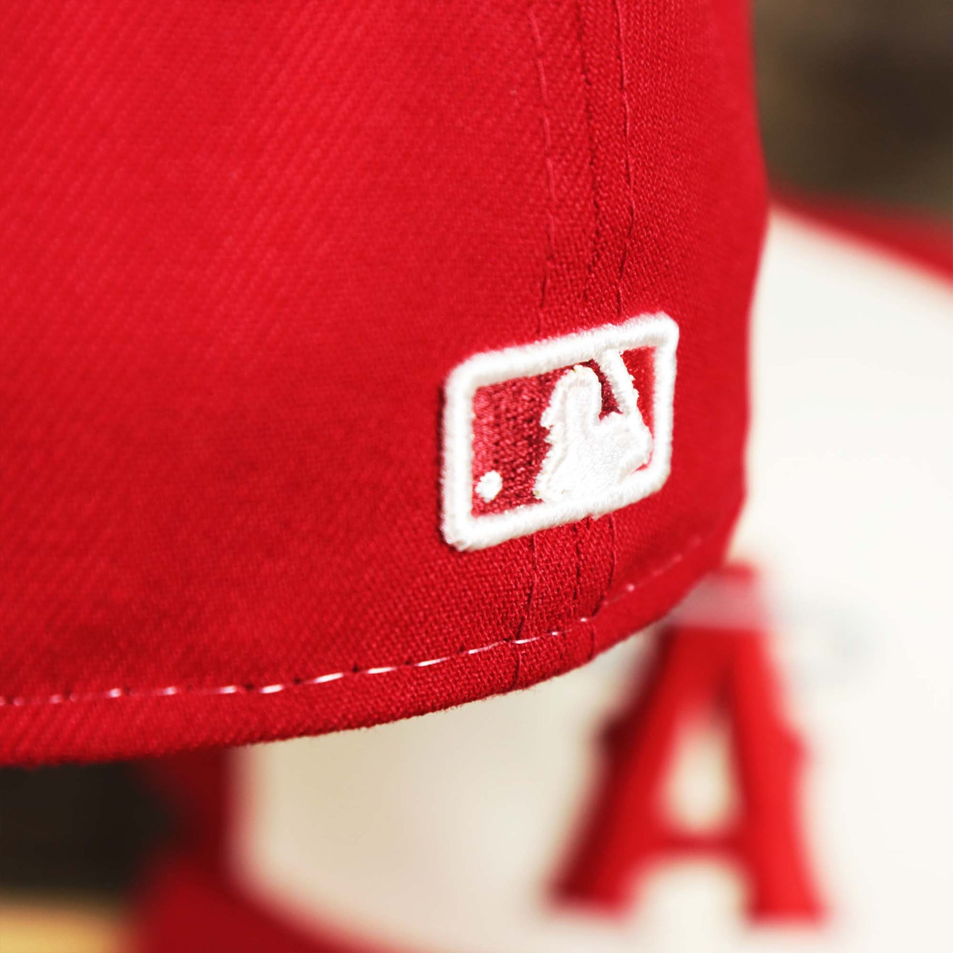 The MLB Batterman logo on the Anaheim Angles 2021 City Connect 59Fifty Fitted Cap | New Era White and Red