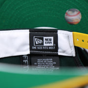 The New Era Tag on the Oakland Athletics MLB Side Font Green Bottom 9Fifty Snapback Cap | Black Snap Cap