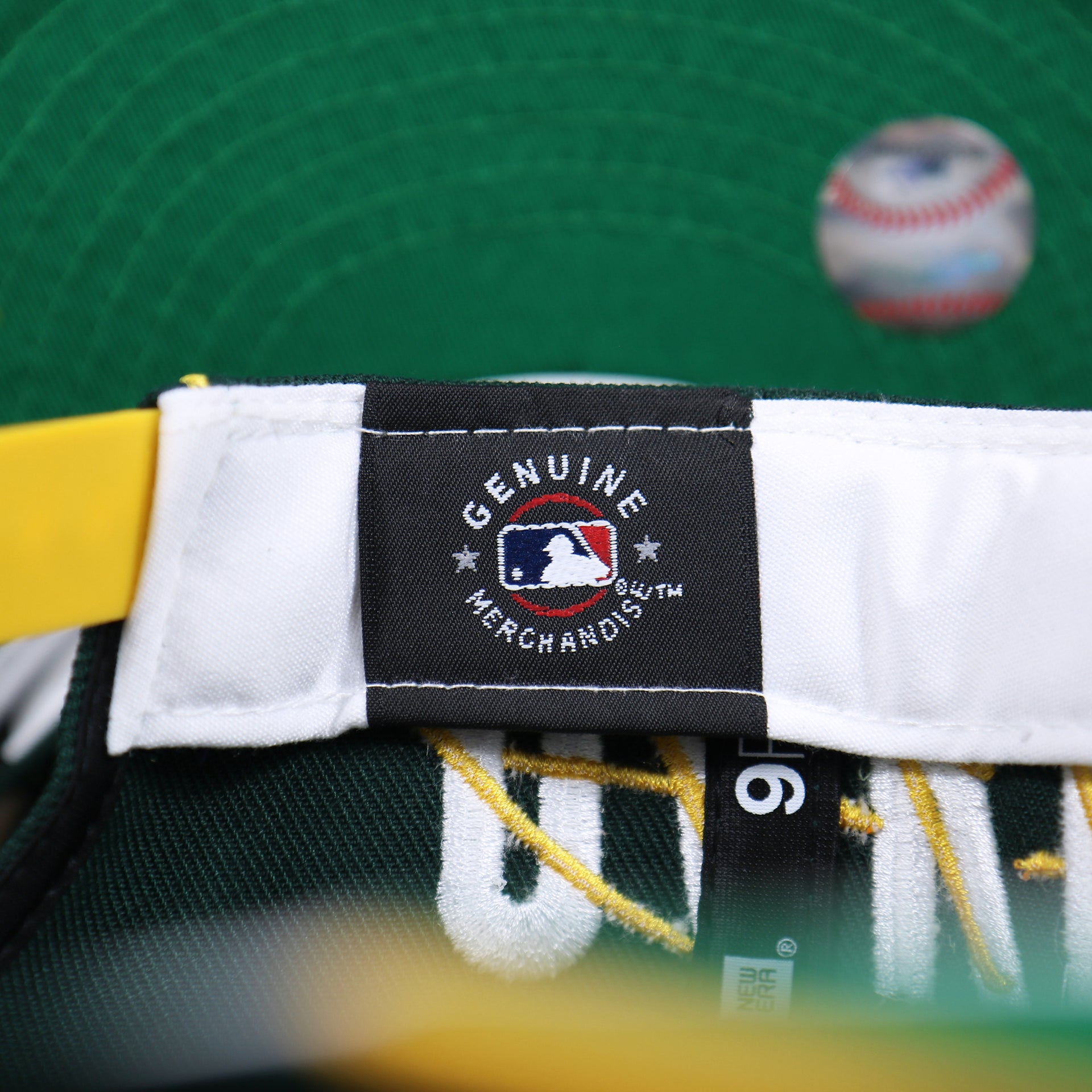 The MLB Merchandise Tag on the Oakland Athletics MLB Side Font Green Bottom 9Fifty Snapback Cap | Black Snap Cap