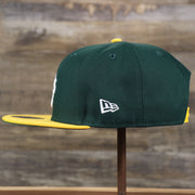 The wearer's left of the Oakland Athletics MLB Side Font Green Bottom 9Fifty Snapback Cap | Black Snap Cap