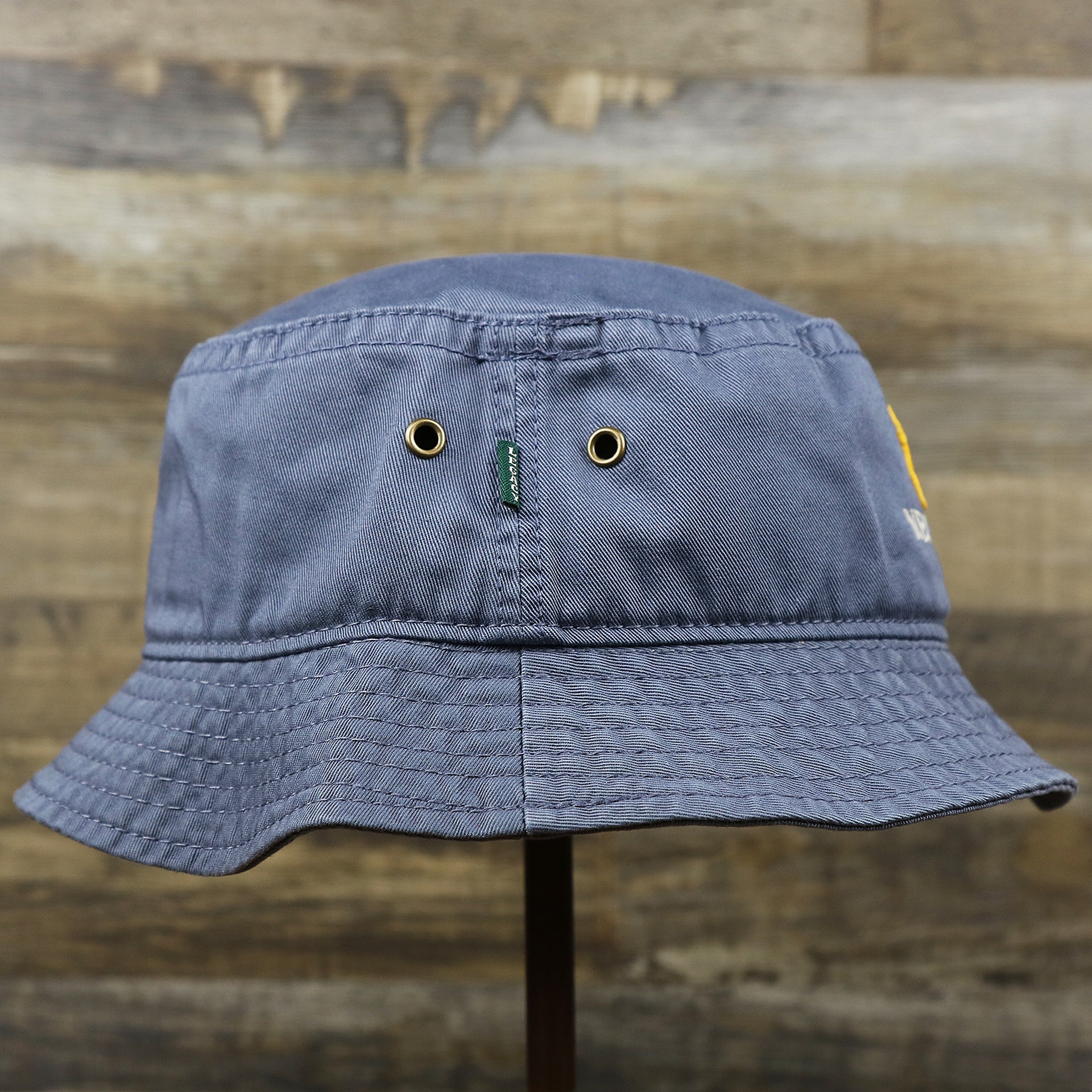 The wearer's right on the Ocean City Anchor New Jersey Wordmark Bucket Hat | Slate Blue Bucket Hat