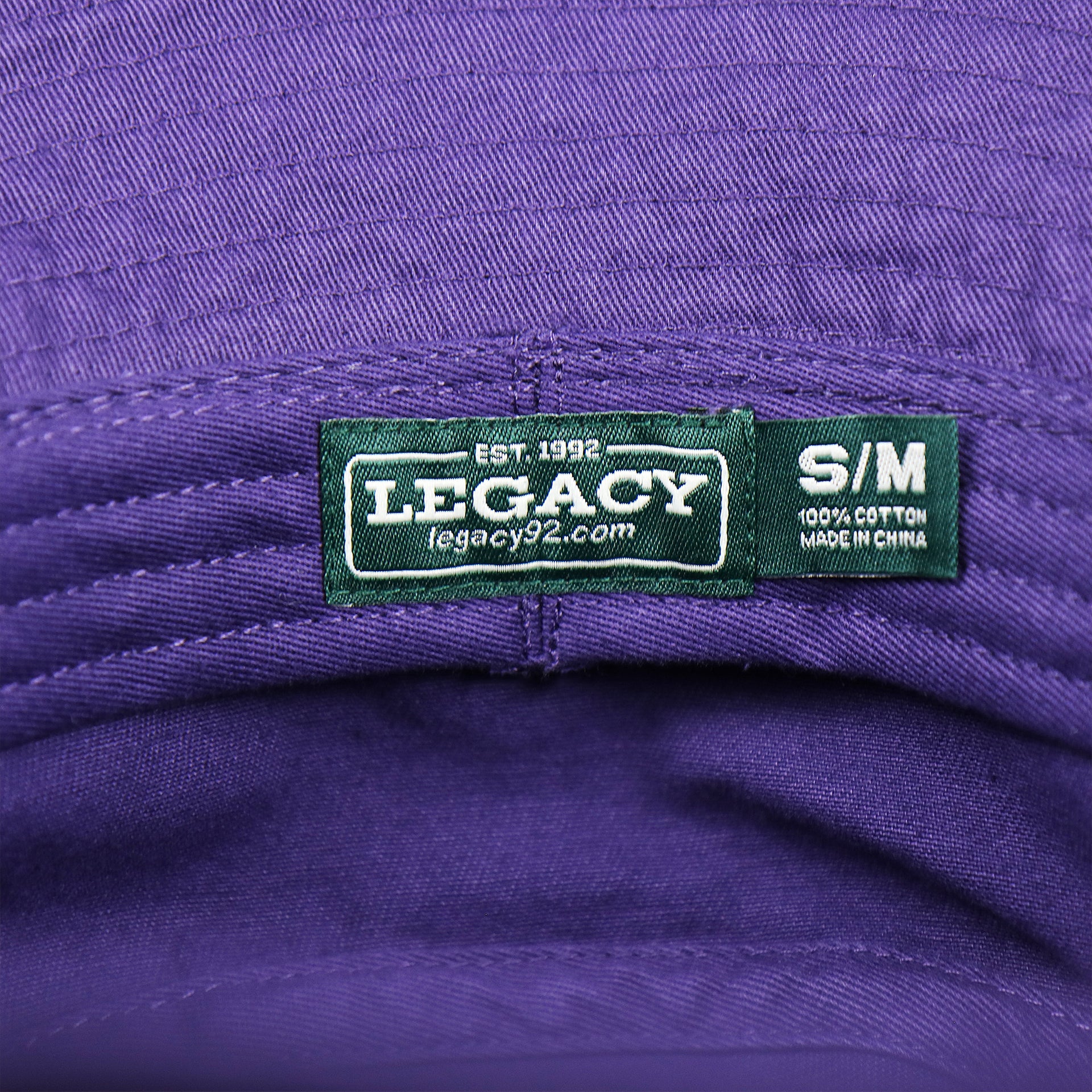 The Legacy Tag on the Green OCNJ Double Wordmark Pink Outline Bucket Hat | Purple Bucket Hat  