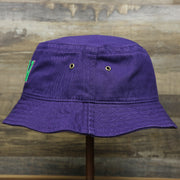 The wearer's left on the Green OCNJ Double Wordmark Pink Outline Bucket Hat | Purple Bucket Hat  