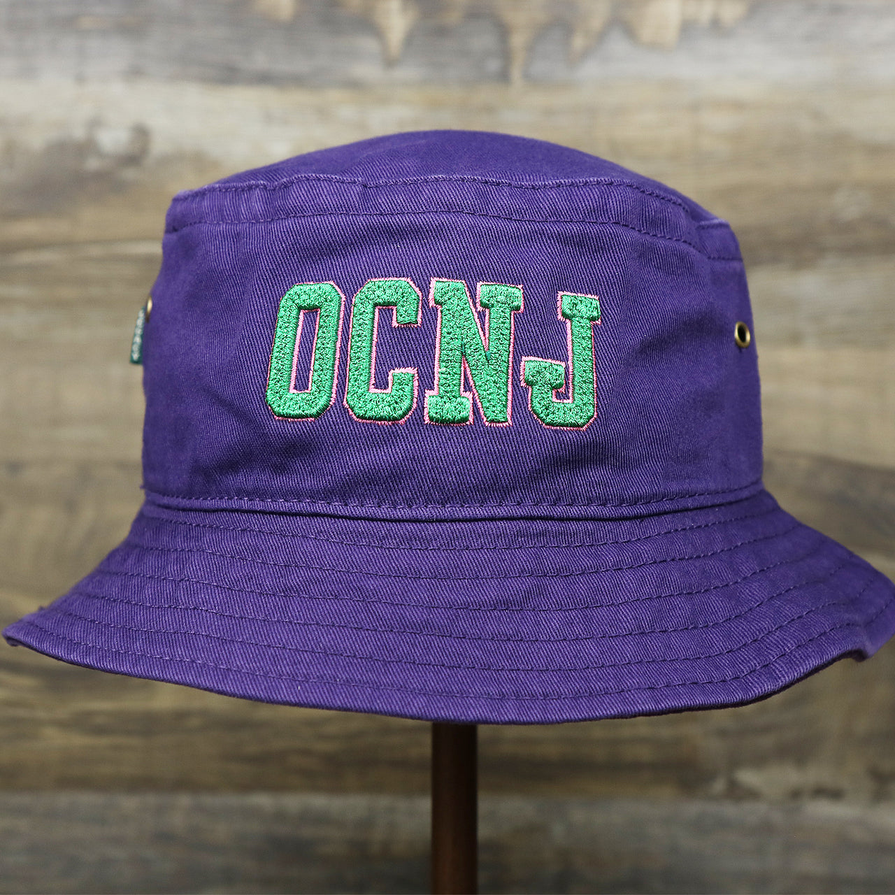 The Green OCNJ Double Wordmark Pink Outline Bucket Hat | Purple Bucket Hat  