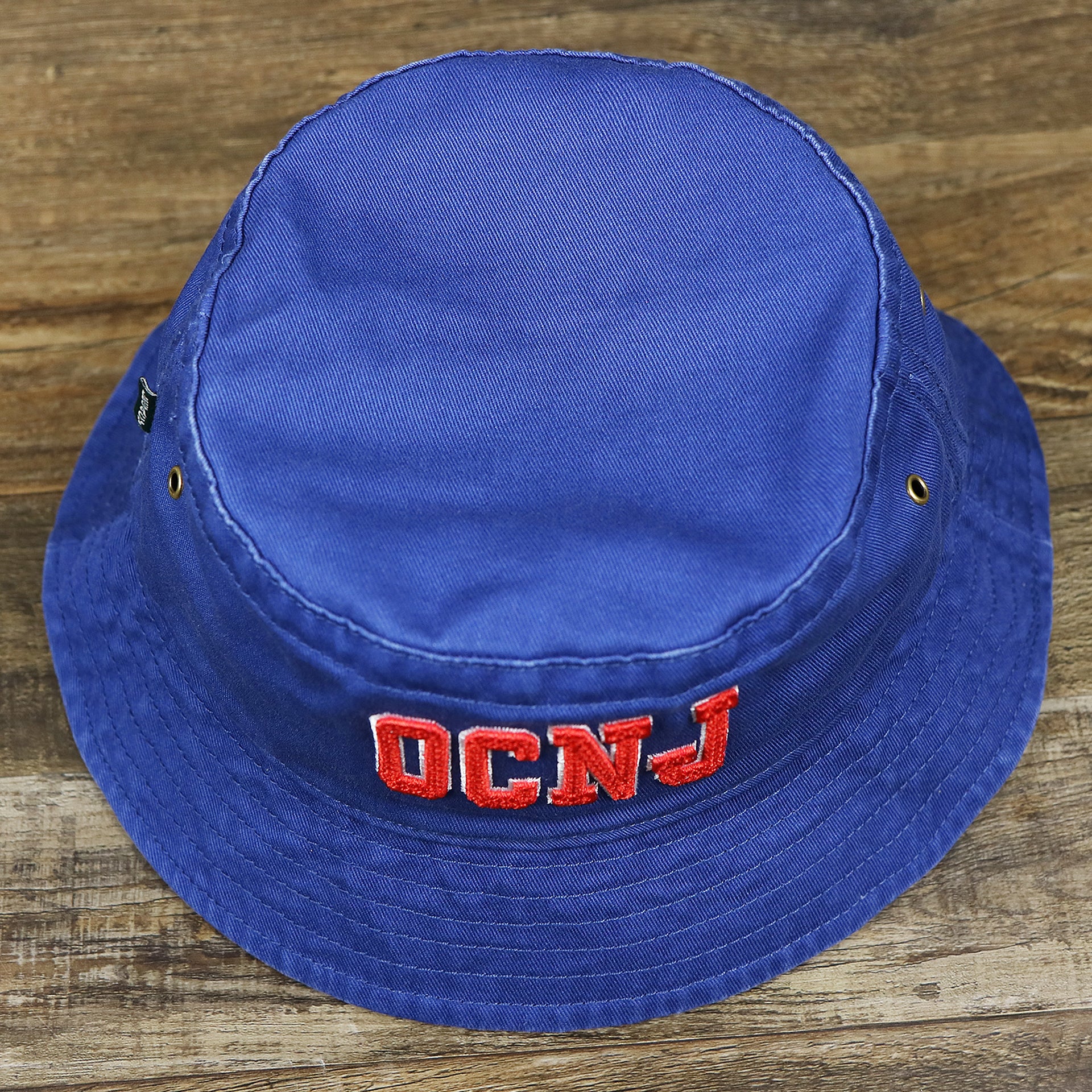 The overhead shot of the Ocean City New Jersey OCNJ Wordmark Bucket Hat | Royal Blue Bucket Hat