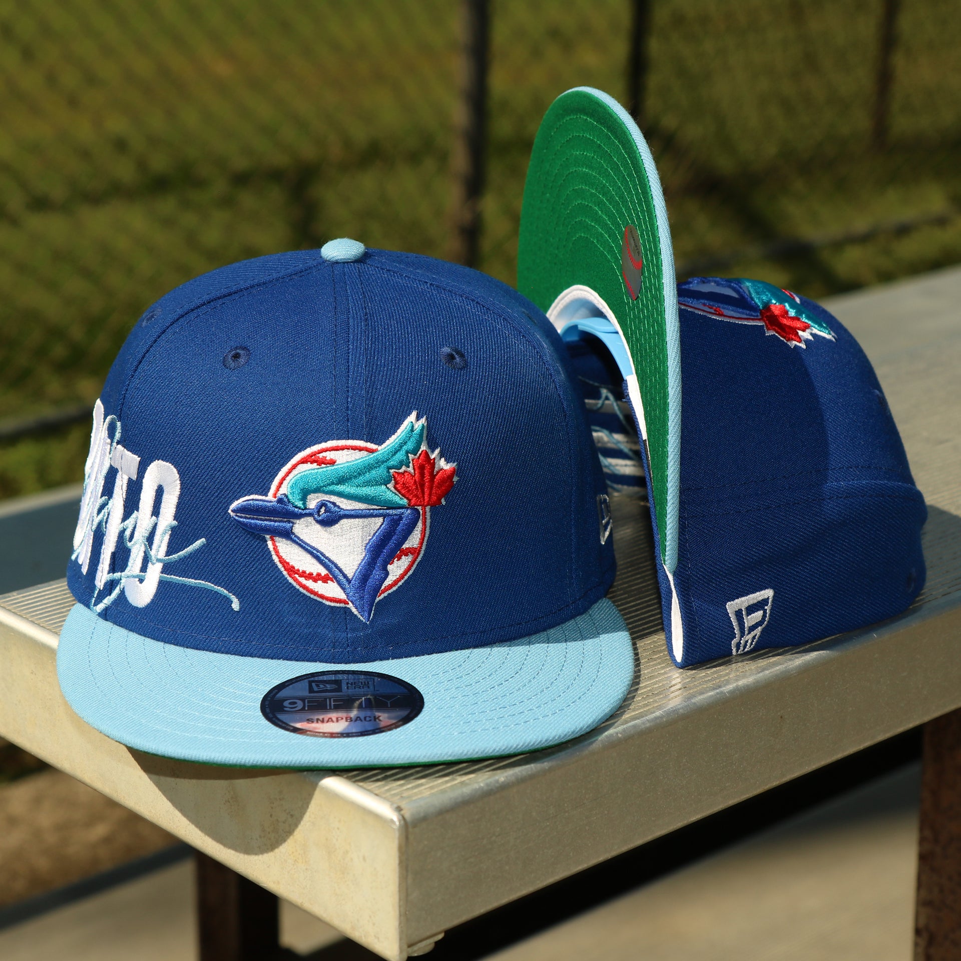 The front of the Cooperstown Toronto Blue Jays MLB Side Font Green Bottom 9Fifty Snapback Cap | Royal Blue Snap Cap