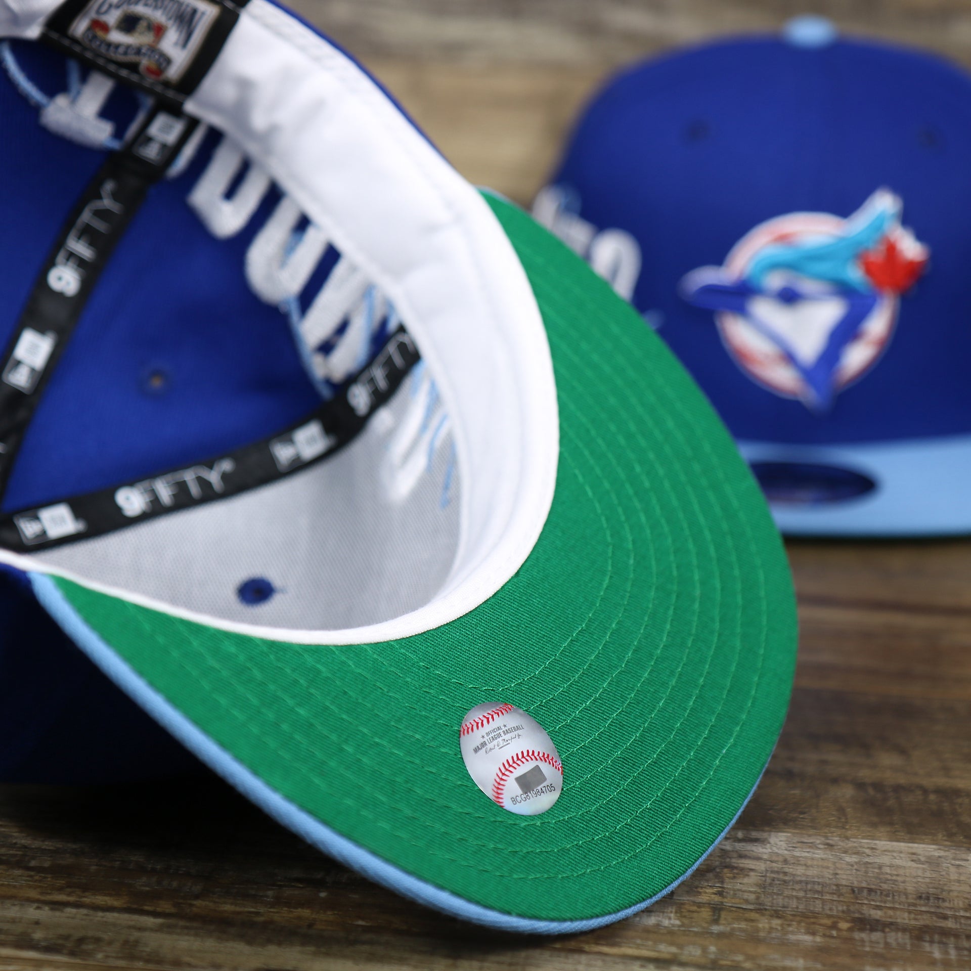 The undervisor on the Cooperstown Toronto Blue Jays MLB Side Font Green Bottom 9Fifty Snapback Cap | Royal Blue Snap Cap