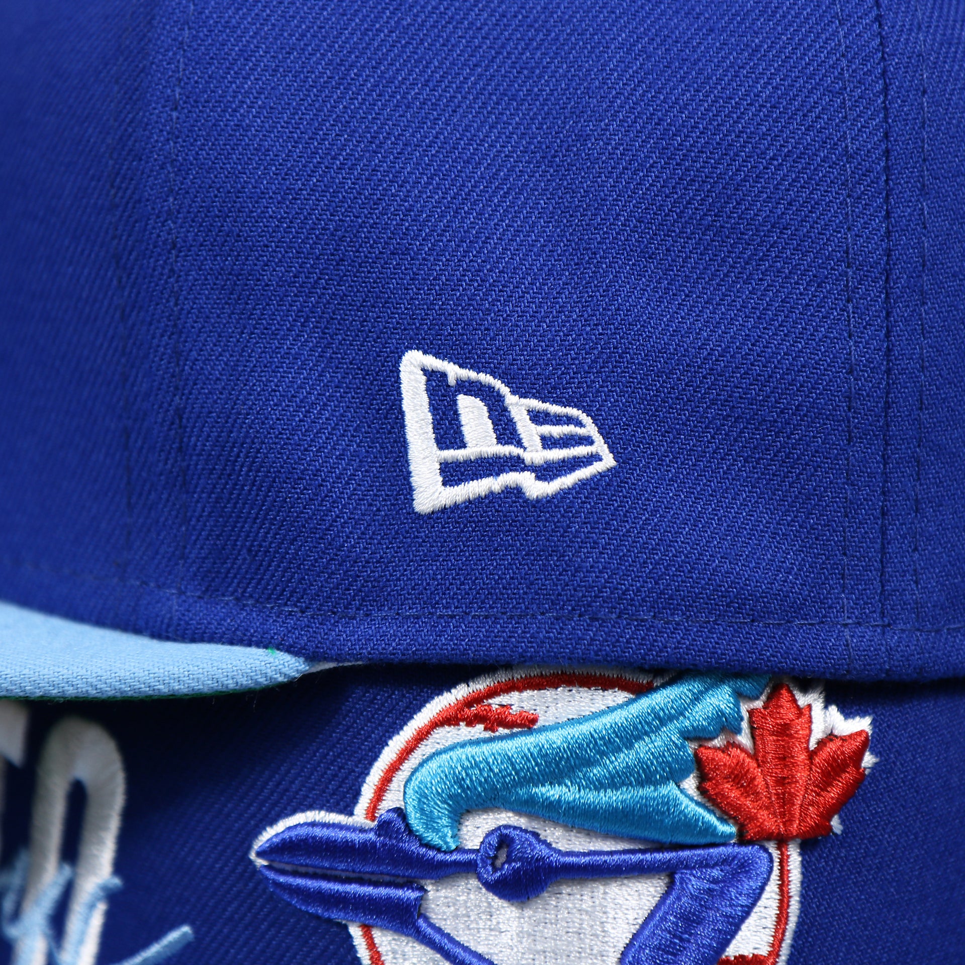 The New Era Logo on the Cooperstown Toronto Blue Jays MLB Side Font Green Bottom 9Fifty Snapback Cap | Royal Blue Snap Cap