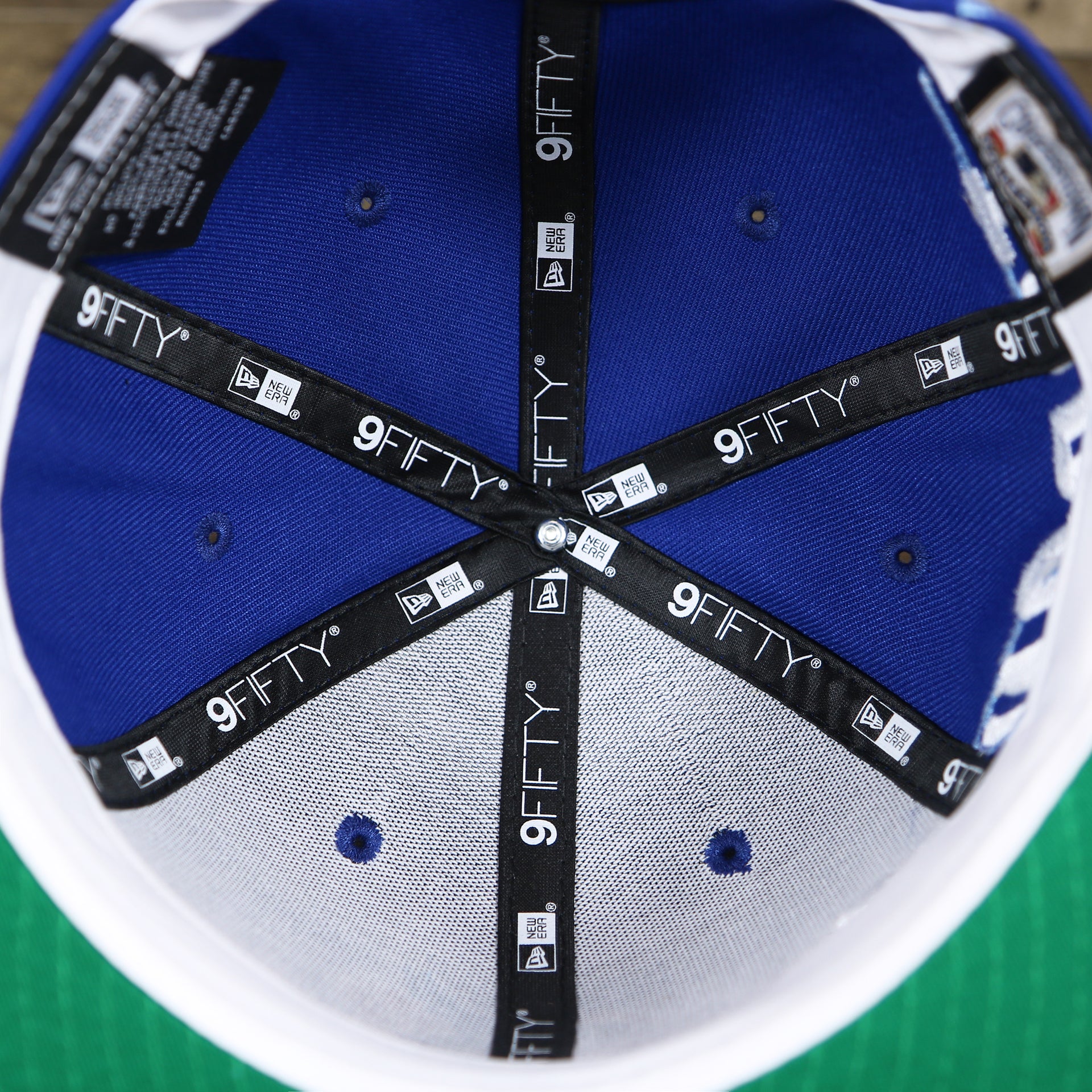 The inside of the Cooperstown Toronto Blue Jays MLB Side Font Green Bottom 9Fifty Snapback Cap | Royal Blue Snap Cap