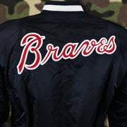 The Braves Wordmark on the Atlanta Braves MLB Patch Alpha Industries Reversible Bomber Jacket With Camo Liner | Navy Blue Bomber Jacket