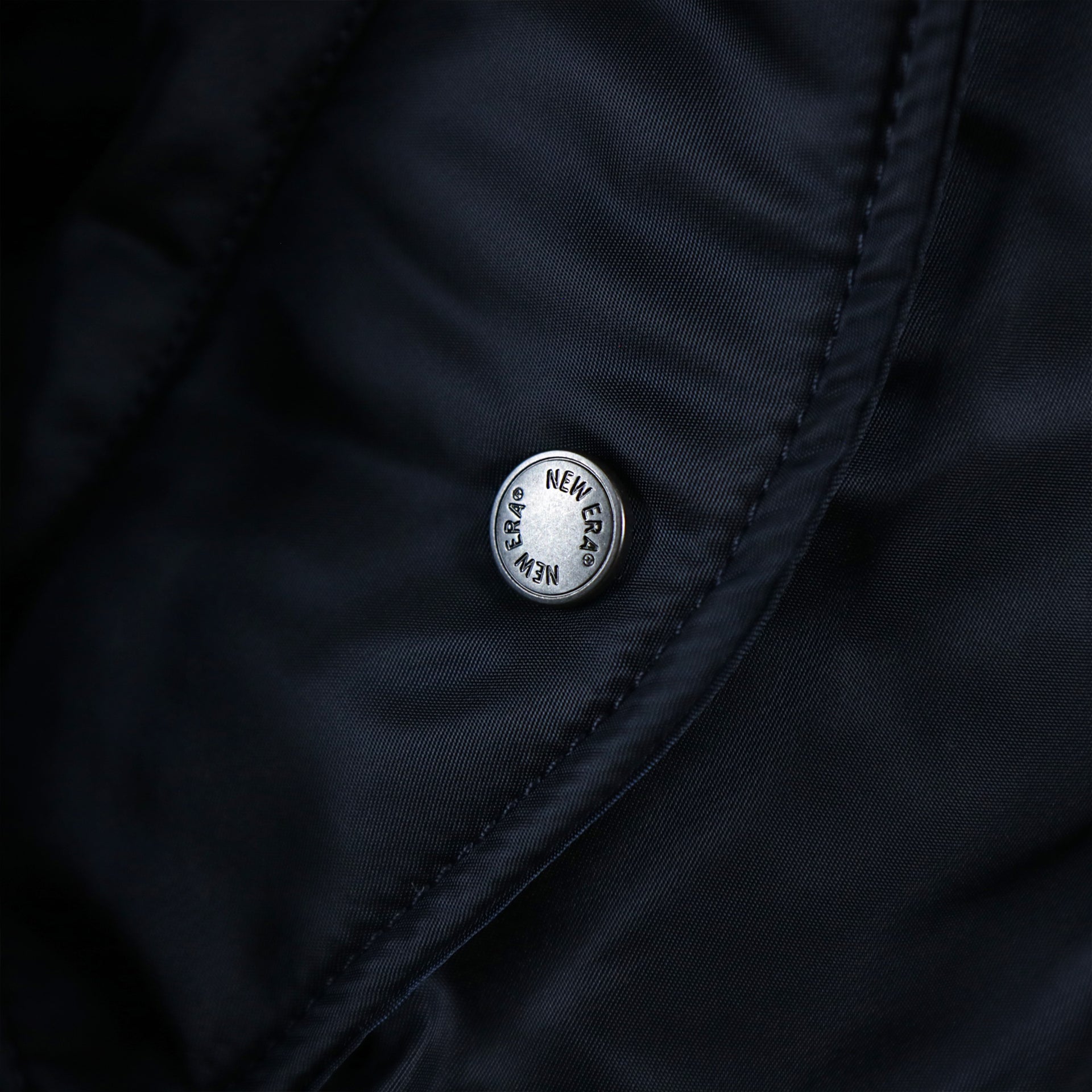 The Custom Metal Buttons With New Era Wordmark on the Atlanta Braves MLB Patch Alpha Industries Reversible Bomber Jacket With Camo Liner | Navy Blue Bomber Jacket