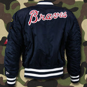 The backside of the Atlanta Braves MLB Patch Alpha Industries Reversible Bomber Jacket With Camo Liner | Navy Blue Bomber Jacket