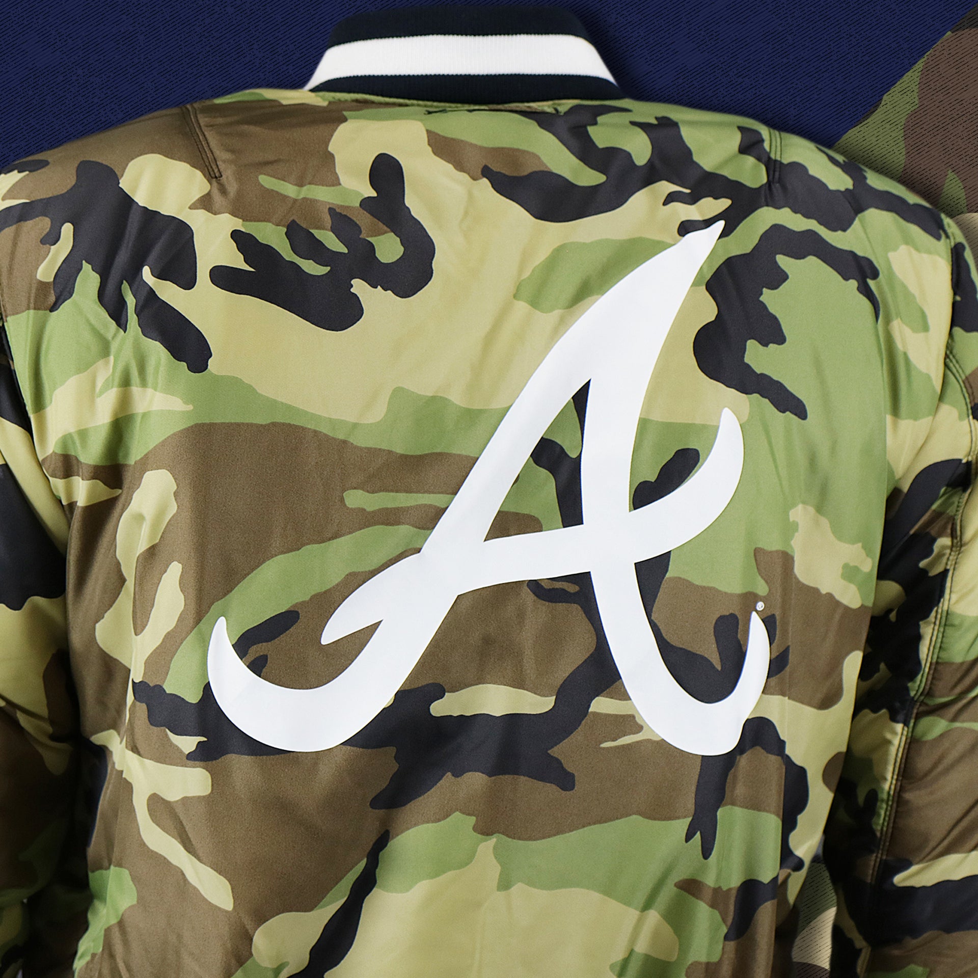 The backside of the Camo Liner on the Atlanta Braves MLB Patch Alpha Industries Reversible Bomber Jacket With Camo Liner | Navy Blue Bomber Jacket