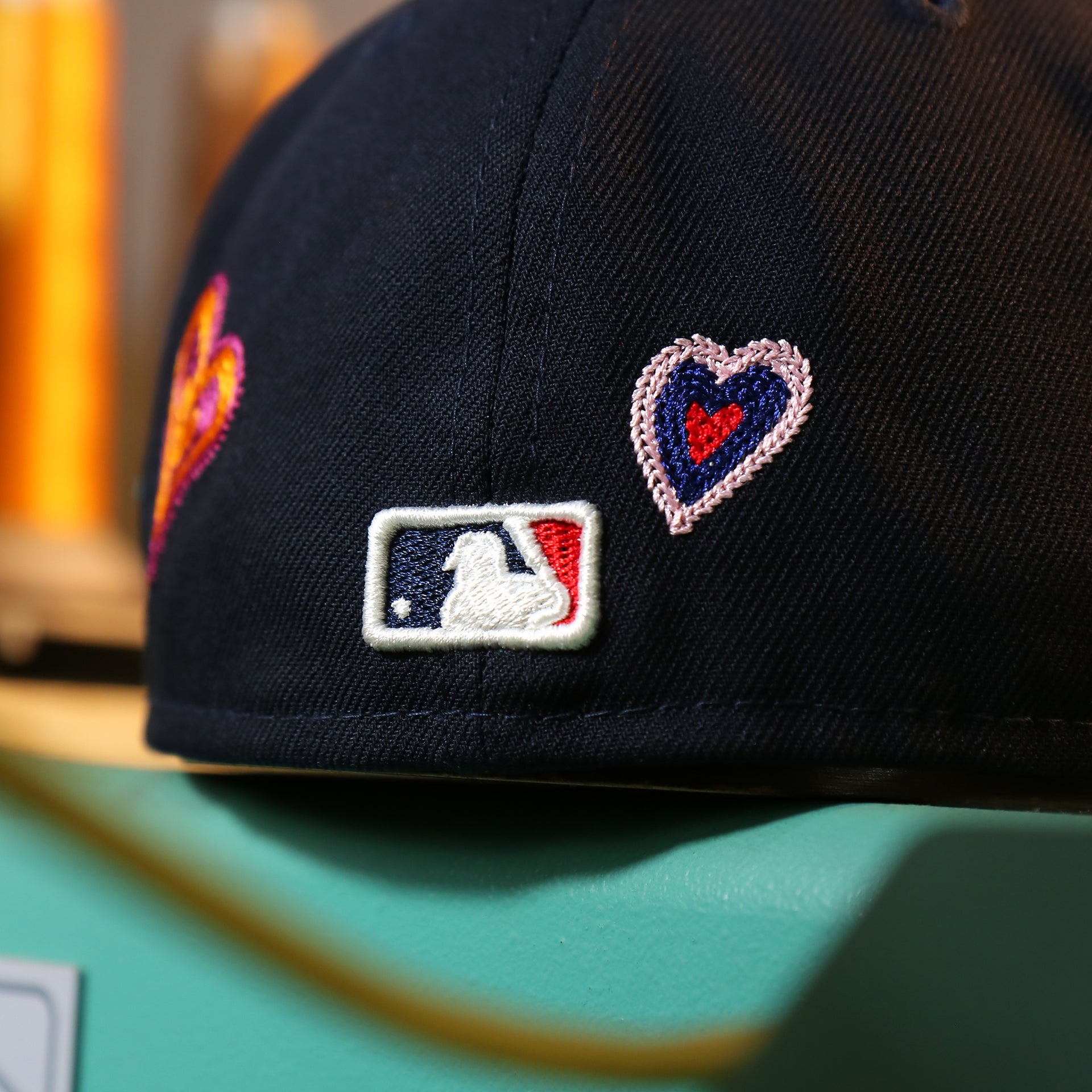 Back of the Atlanta Braves All Over Embroidered Chain Stitch Heart Pink Bottom 59Fifty Fitted Cap | Navy 59Fifty Cap