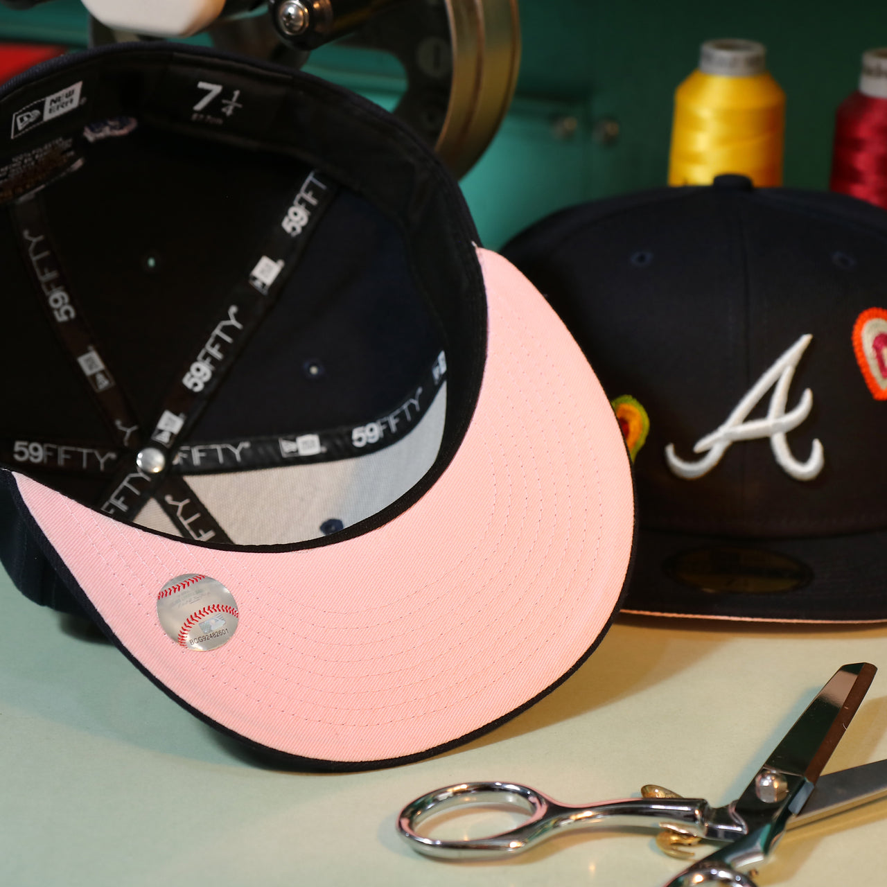Pink uv on the Atlanta Braves All Over Embroidered Chain Stitch Heart Pink Bottom 59Fifty Fitted Cap | Navy 59Fifty Cap