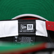 The New Era tag on the Tampa Bay Buccaneers NFL Side Font Green Bottom 9Fifty Snapback Cap | Black Snap Cap