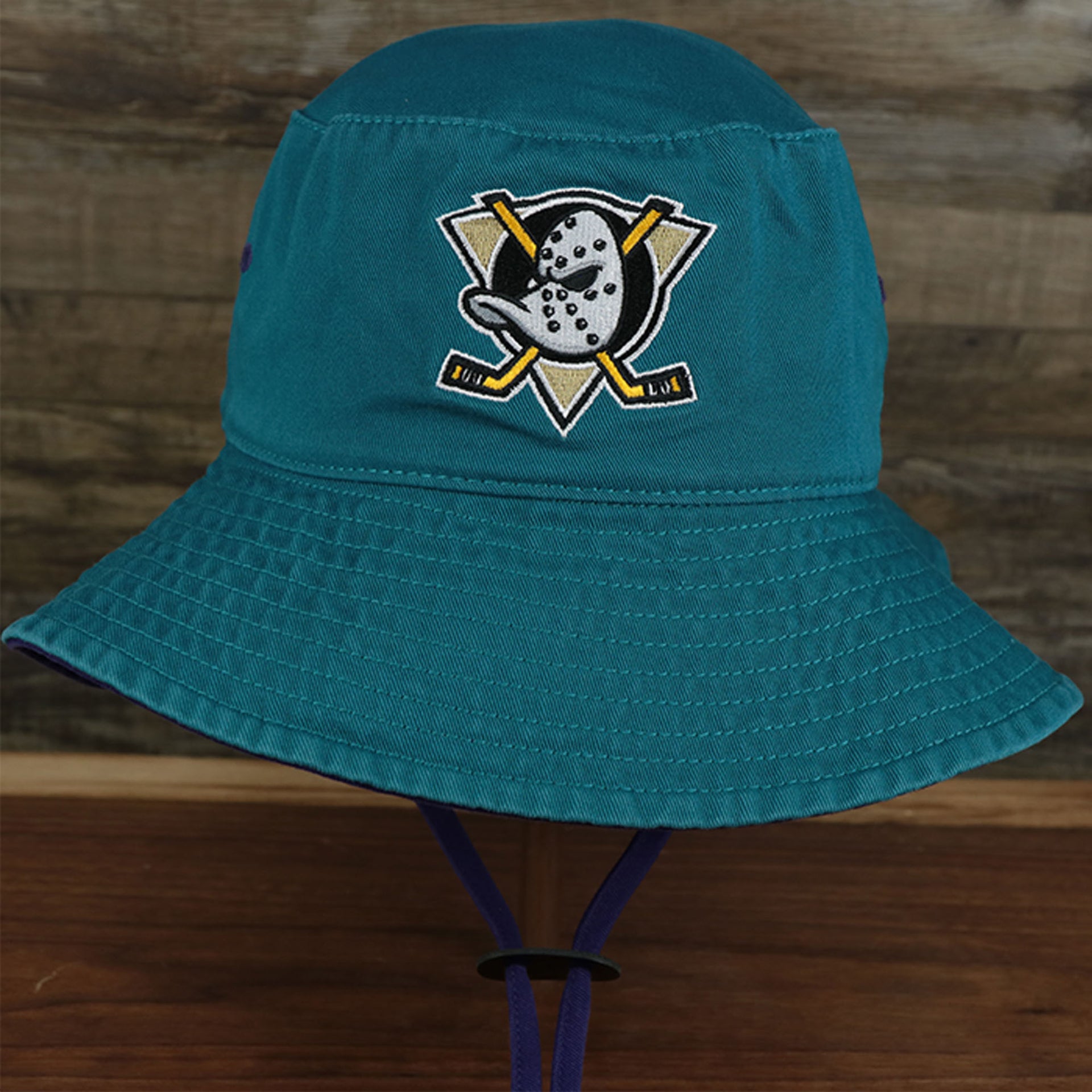 The front of the Mighty Ducks Vintage 90s Anaheim Ducks Grape 5s Matching Bucket Hat | 47 Brand, Dark Teal