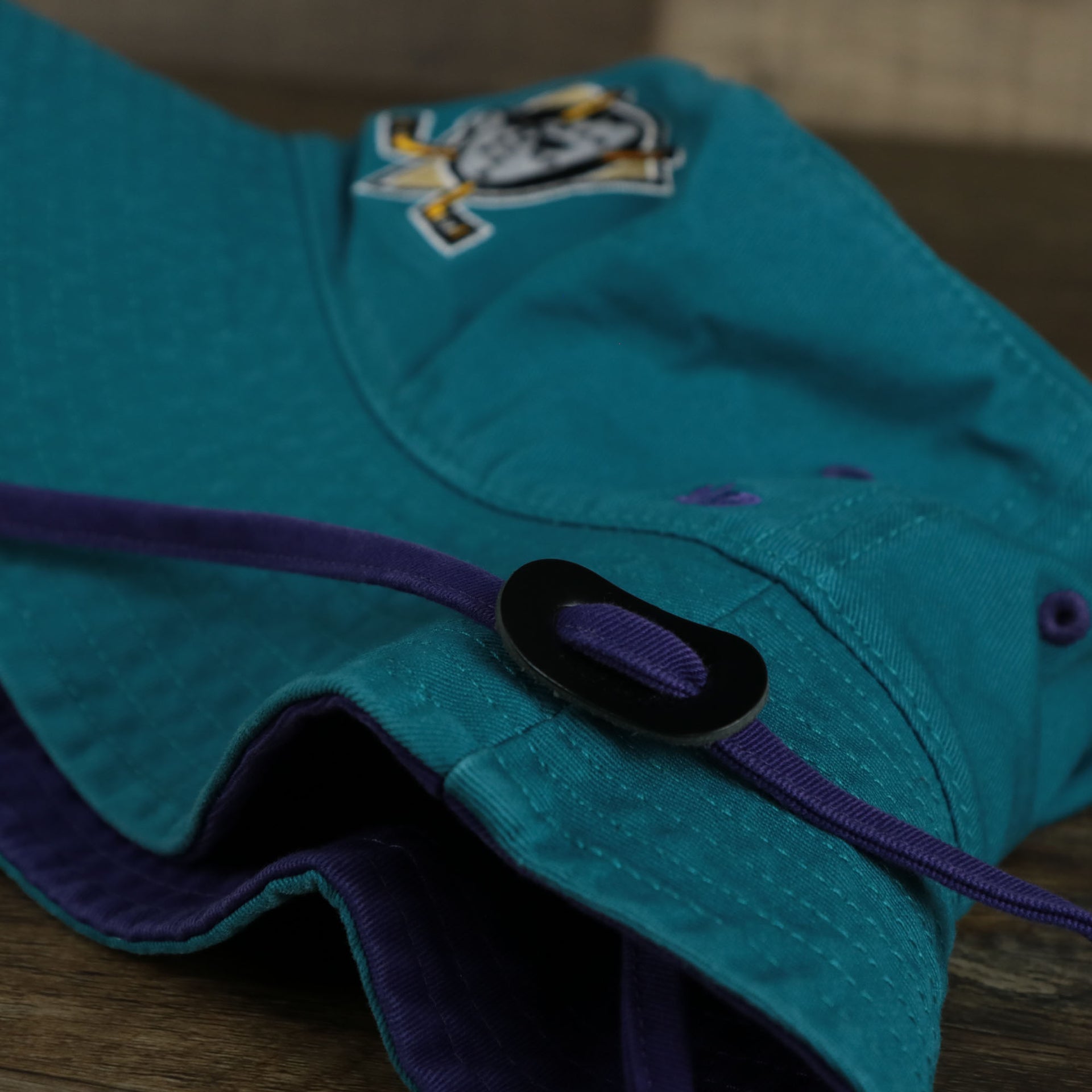 The Mighty Ducks Vintage 90s Anaheim Ducks Grape 5s Matching Bucket Hat | 47 Brand, Dark Teal laying flat