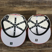 The underside of the Chicago Bulls NBA 2022 Draft Gray Bottom 9Fifty Snapback | New Era Cream/Red with the Youth Version