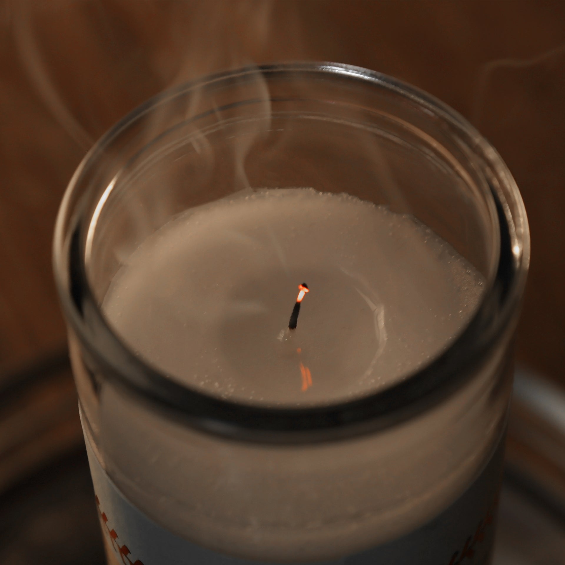 The wick blown out on the Philadelphia Football Game Day Juju Unscented Prayer Candle